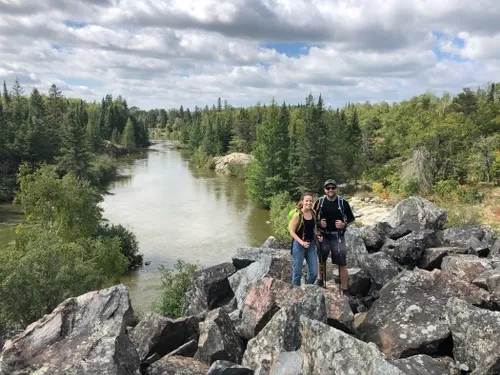 Tour guides in front of Winnipeg river